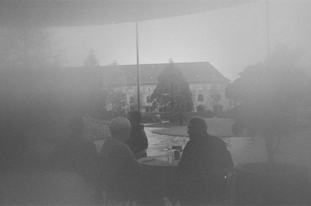 Photographer interviewing an elderly local resident in Denmark
