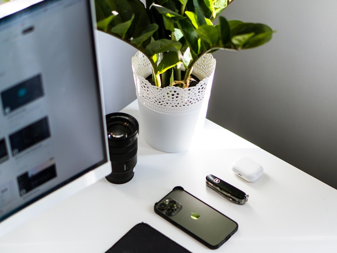Camera, notebook and coffee cup on a wooden desk